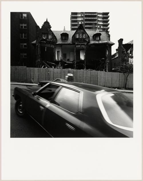 View of a partially demolished semidetached house, rue Drummond, Montréal, Québec