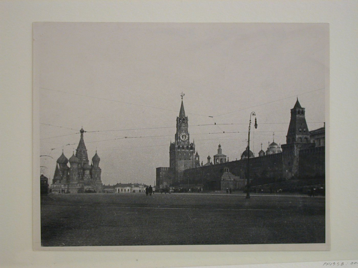 View of Red Square showing Saint Basil Cathedral, Spasskaia Tower and the second wooden Lenin Mausoleum, Moscow