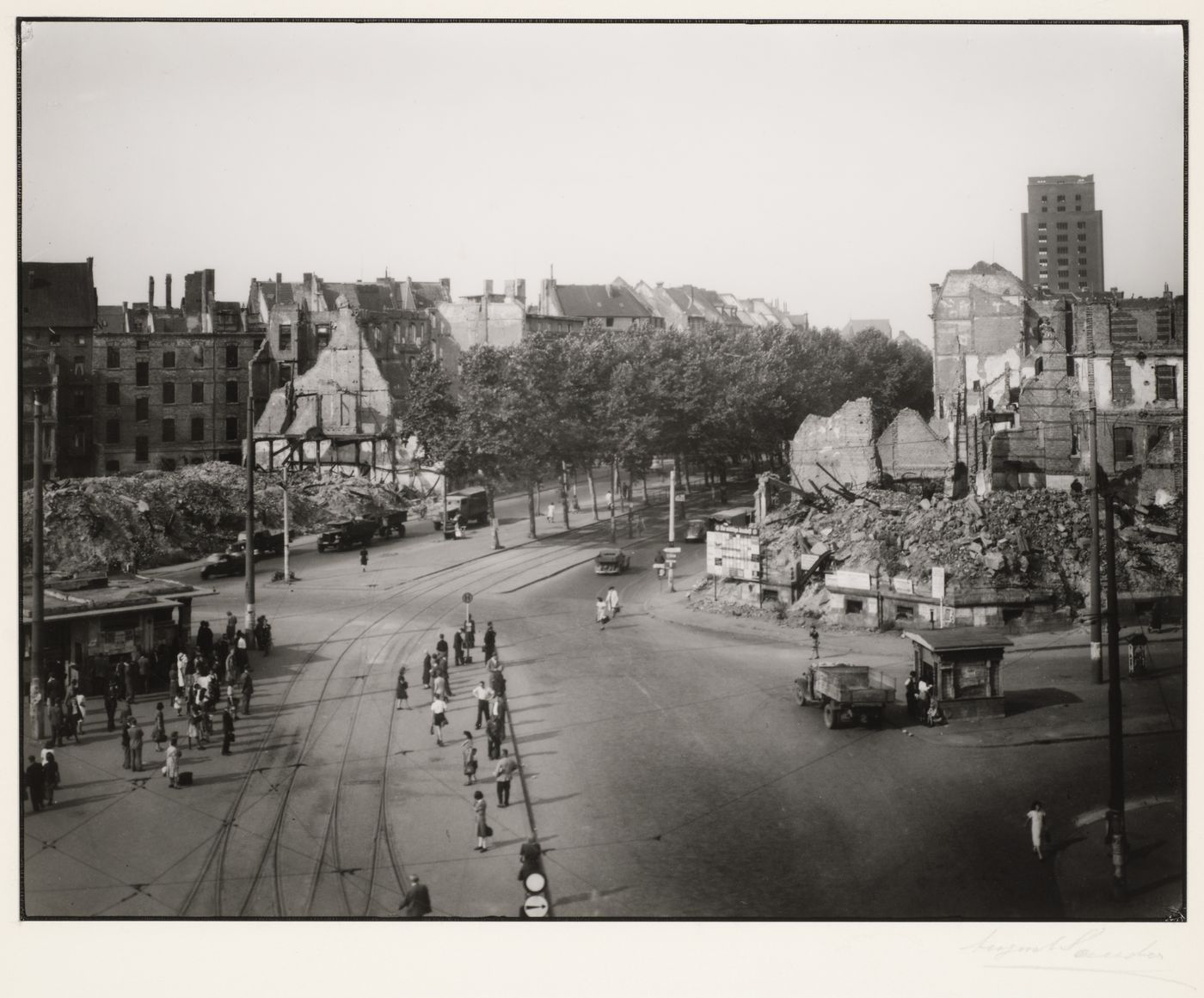 View of Deutscher Platz with high-rise building and tram tracks, Cologne, Germany