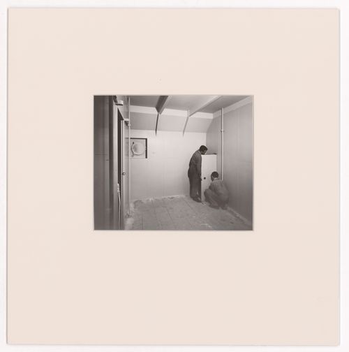 View of two men constructing an ocean liner cabin for the Otua, Salon d'automne, Paris, France