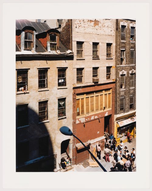 Rivington Street, looking down at people gambling in street, New York City, New York, United States