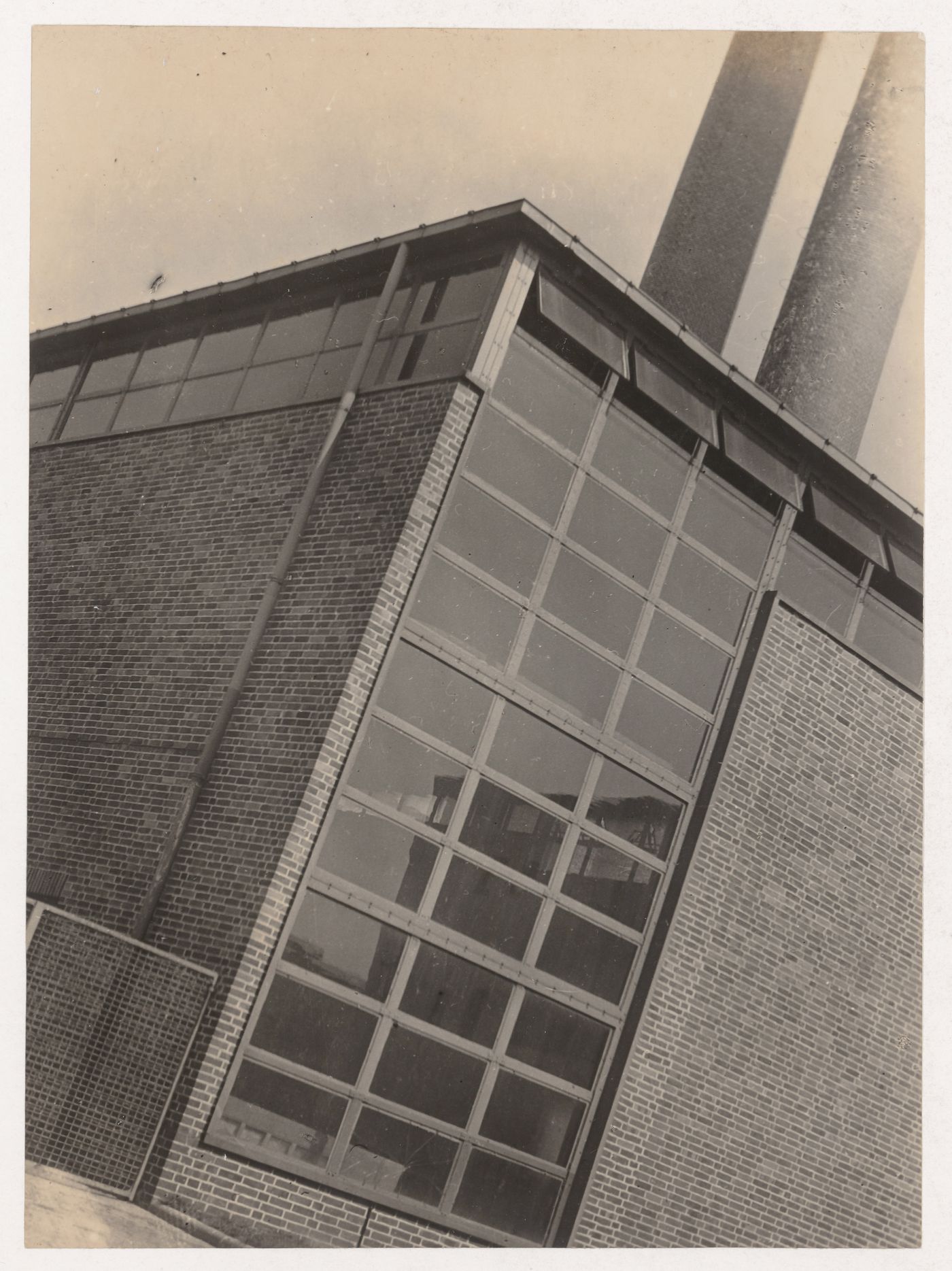 Oblique view of the corner of an unidentified building and smokestack, probably in Germany