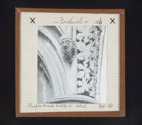 Detail view of sculpture of head and extrados ornamentation in vestibule of Chapter House, Southwell Minster, Southwell, Nottinghamshire, England
