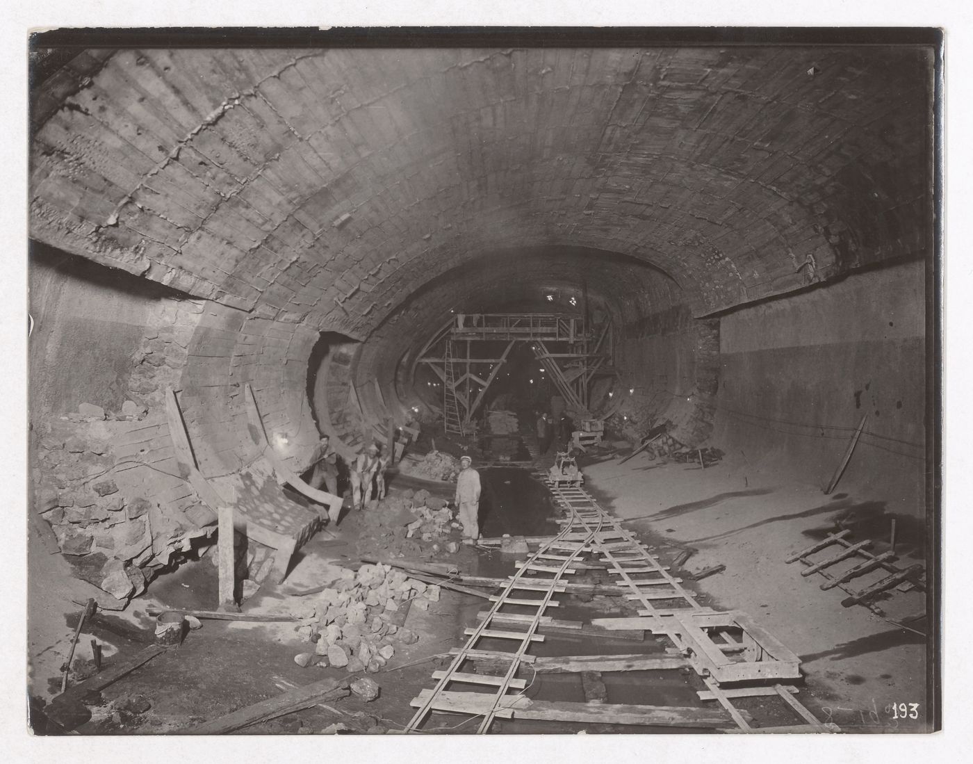 Construction of the Paris Metro, interior view of the tunnel with workers and tracks, Paris, France