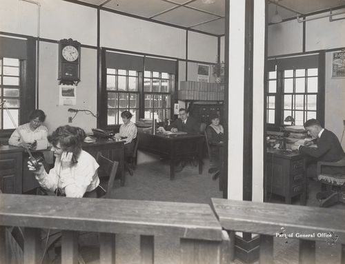 Interior view of general office with workers at the Energite Explosives Plant No. 3, the Shell Loading Plant, Renfrew, Ontario, Canada
