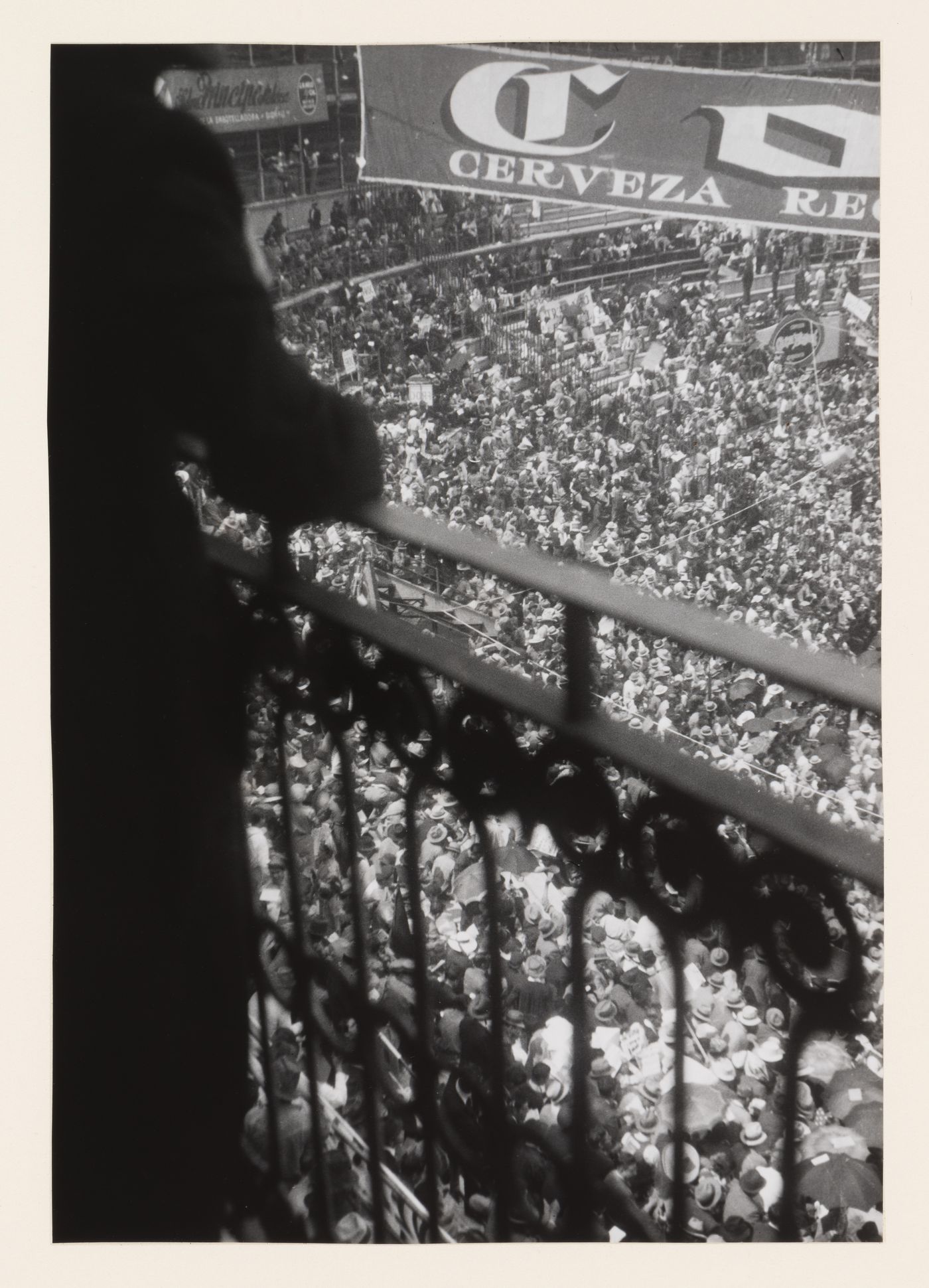 Crowd seen from wrought iron balcony above, Mexico, Mexico
