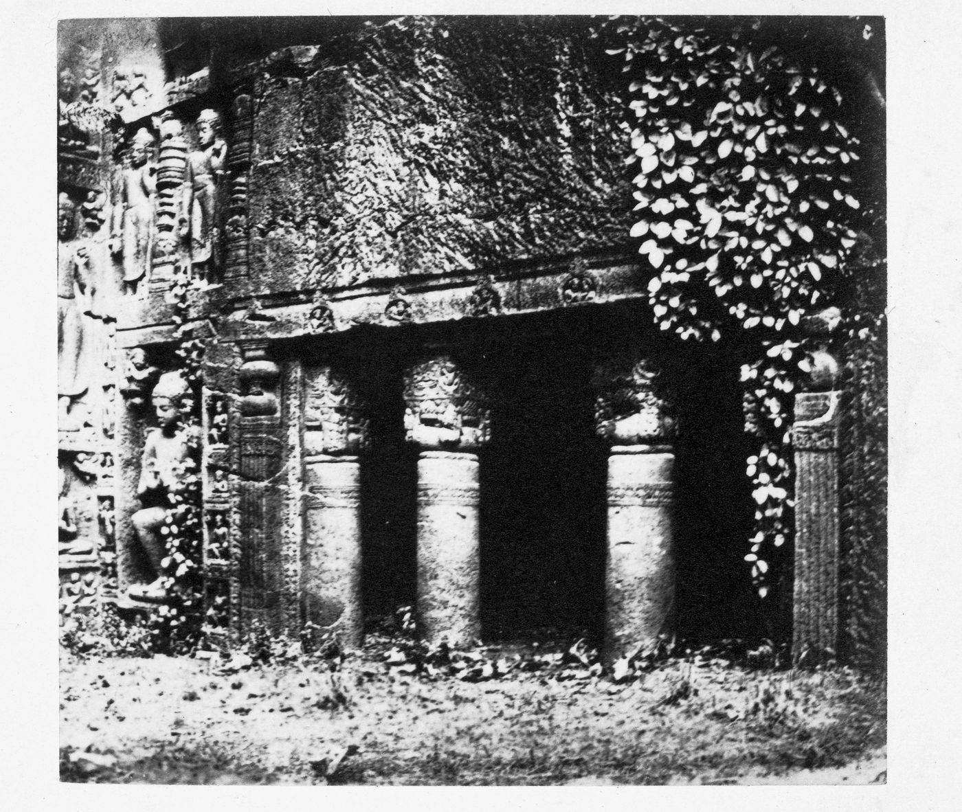 View of the caravanserais showing façade reliefs on the left, Cave 19, Ajanta, India