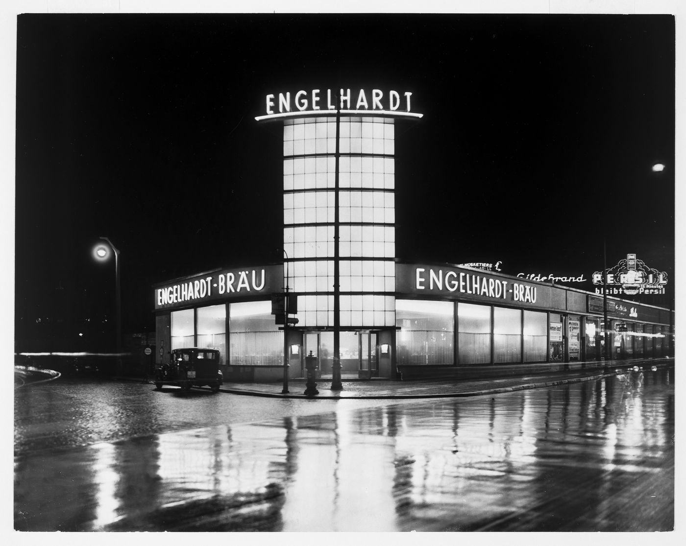 Night view of illuminated signs on Engelhardt tower, Berlin, Germany