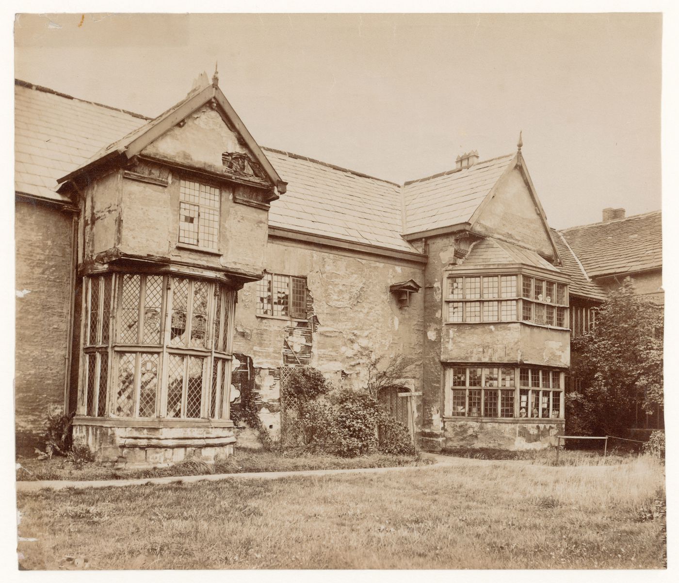 Exterior view of the dilapitated windows of Ordsall Hall, Salford, England