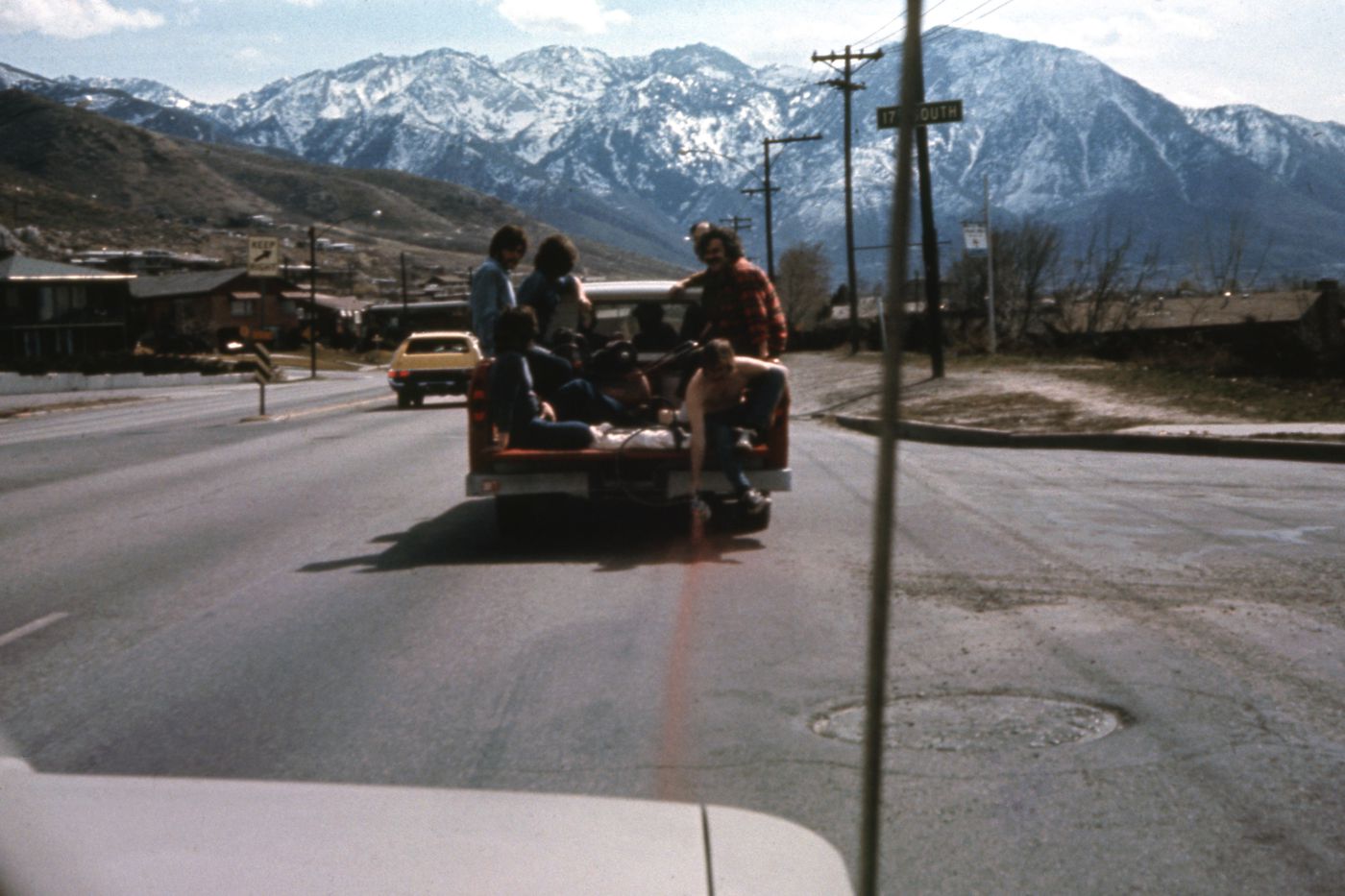 Photograph of students in back of truck during performance of Red Line