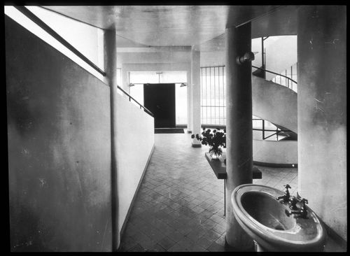 Interior view of the entrance hall showing the ramp, spiral staircase, pilotis and sink, Villa Savoye, Poissy, France
