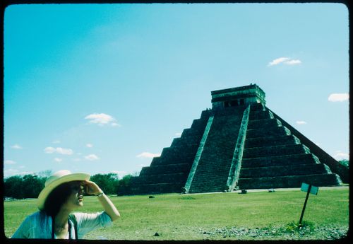 Woman near the "El Castillo" pyramid, Chichen Itza, Mexico