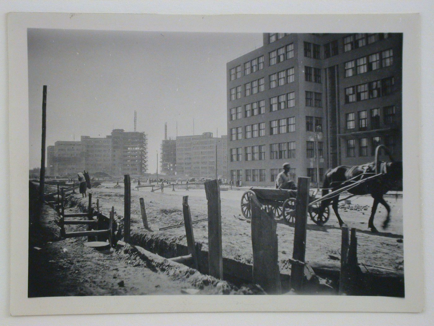 Exterior view of the Department of Industry and Planning (Gosprom) buildings with the House of Planning Organizations buildings under construction in the background, Kharkov, Soviet Union (now in Ukraine)