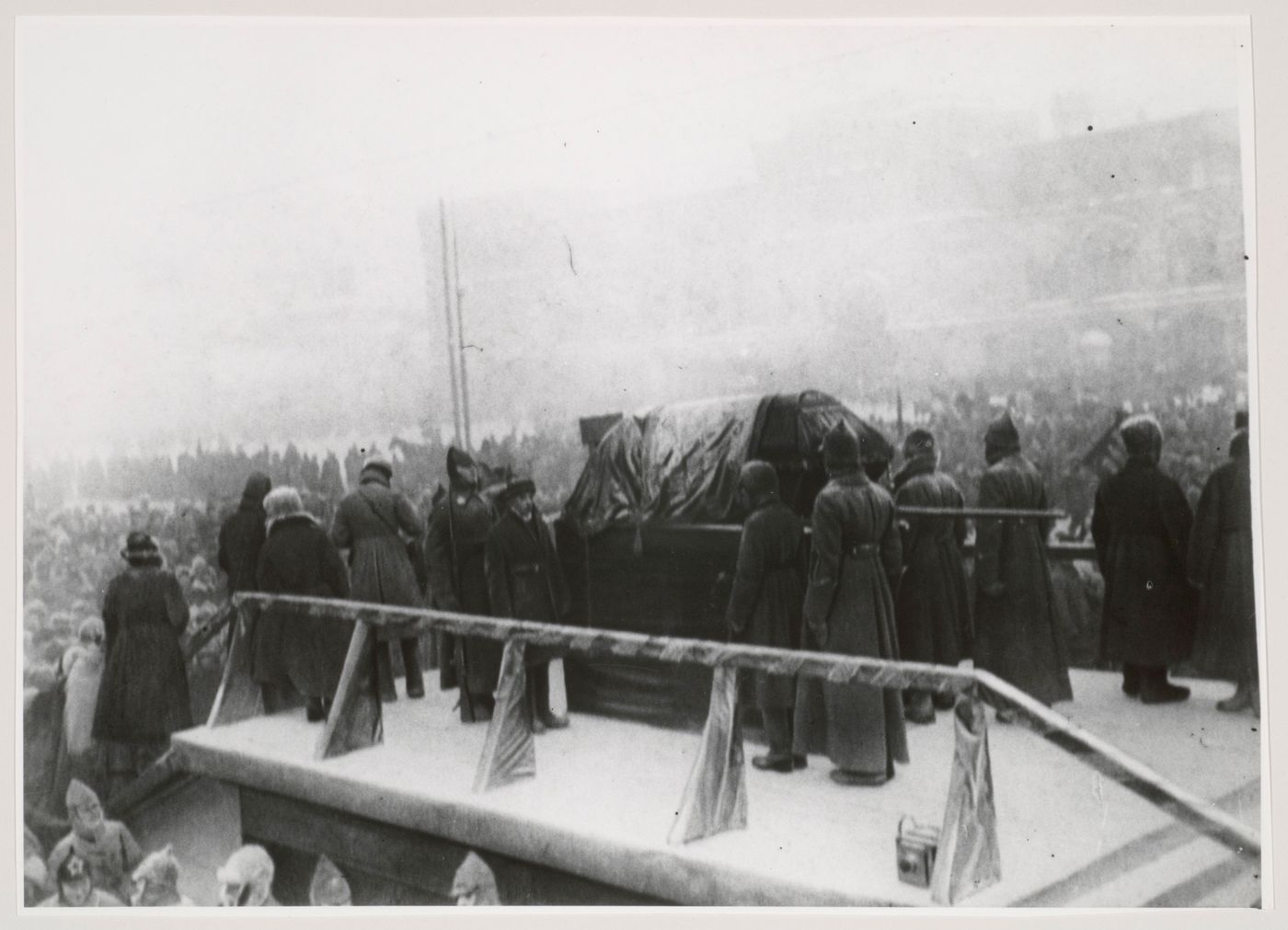 View of Lenin's funeral showing the coffin and soldiers on a podium and the Upper Shopping Arcades in the background, Red Square, Moscow