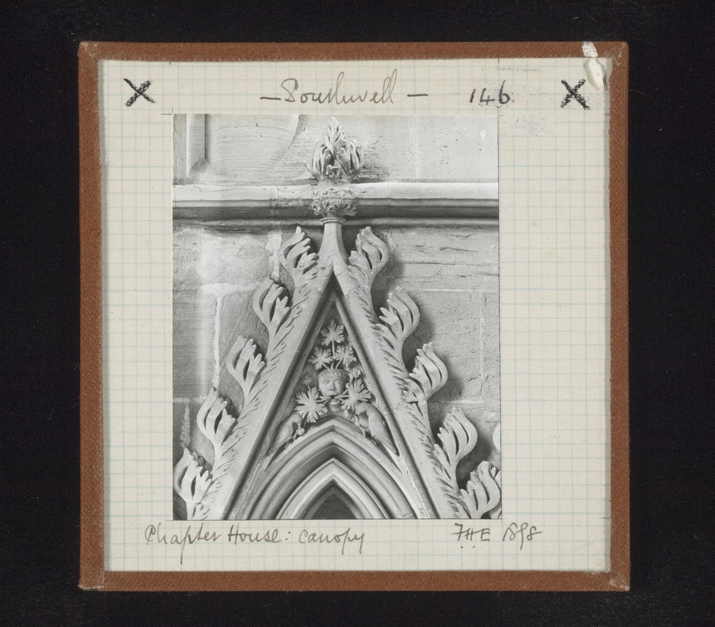 View of canopy with foliate mask and two birds on tympanum in Chapter House, Southwell Minster, Southwell, Nottinghamshire, England