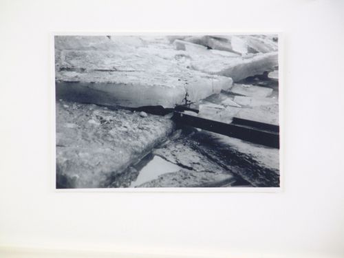 View of steel beam in sheet of ice