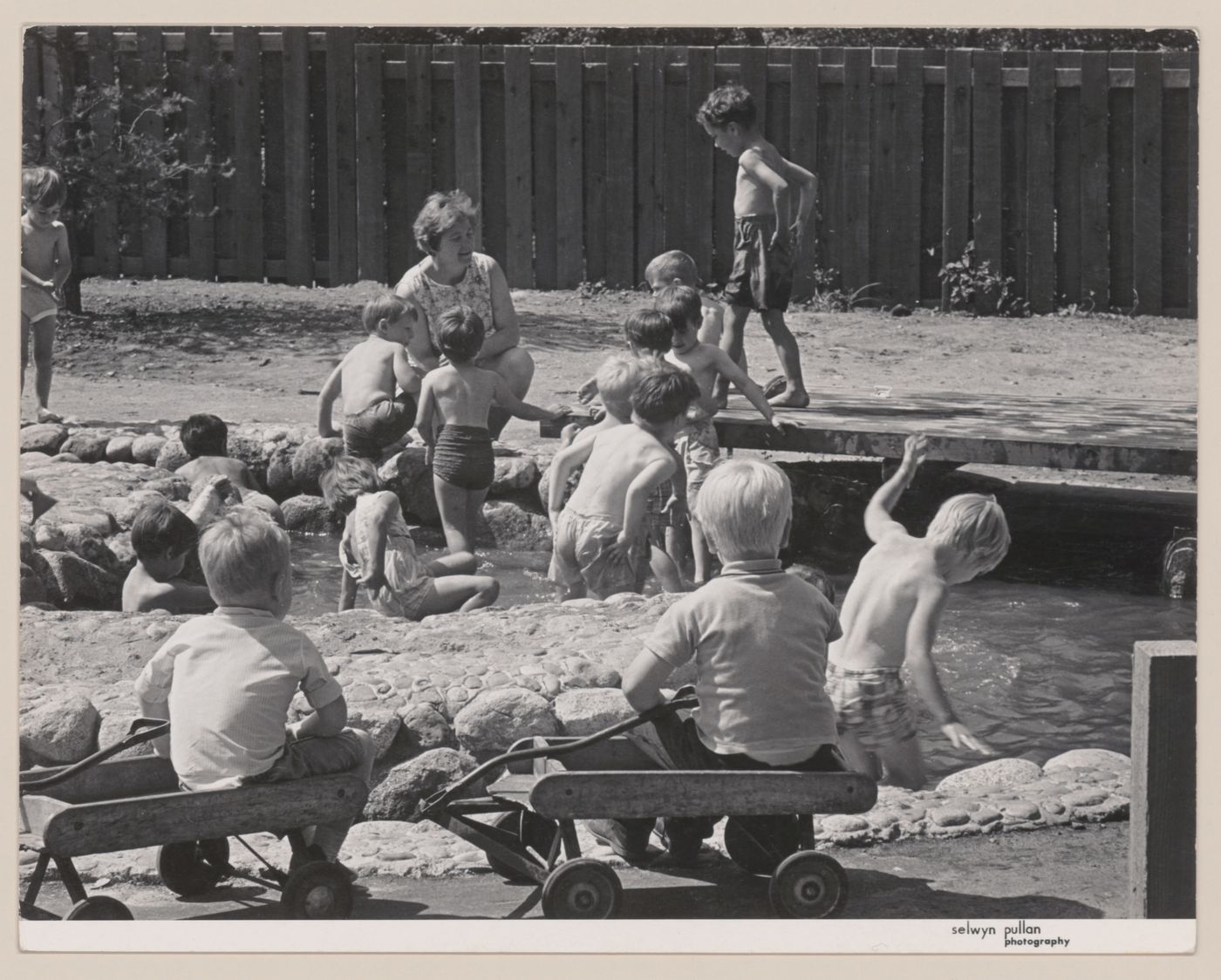 View of children playing in North Shore Neighbourhood House Playground, Vancouver, British Columbia