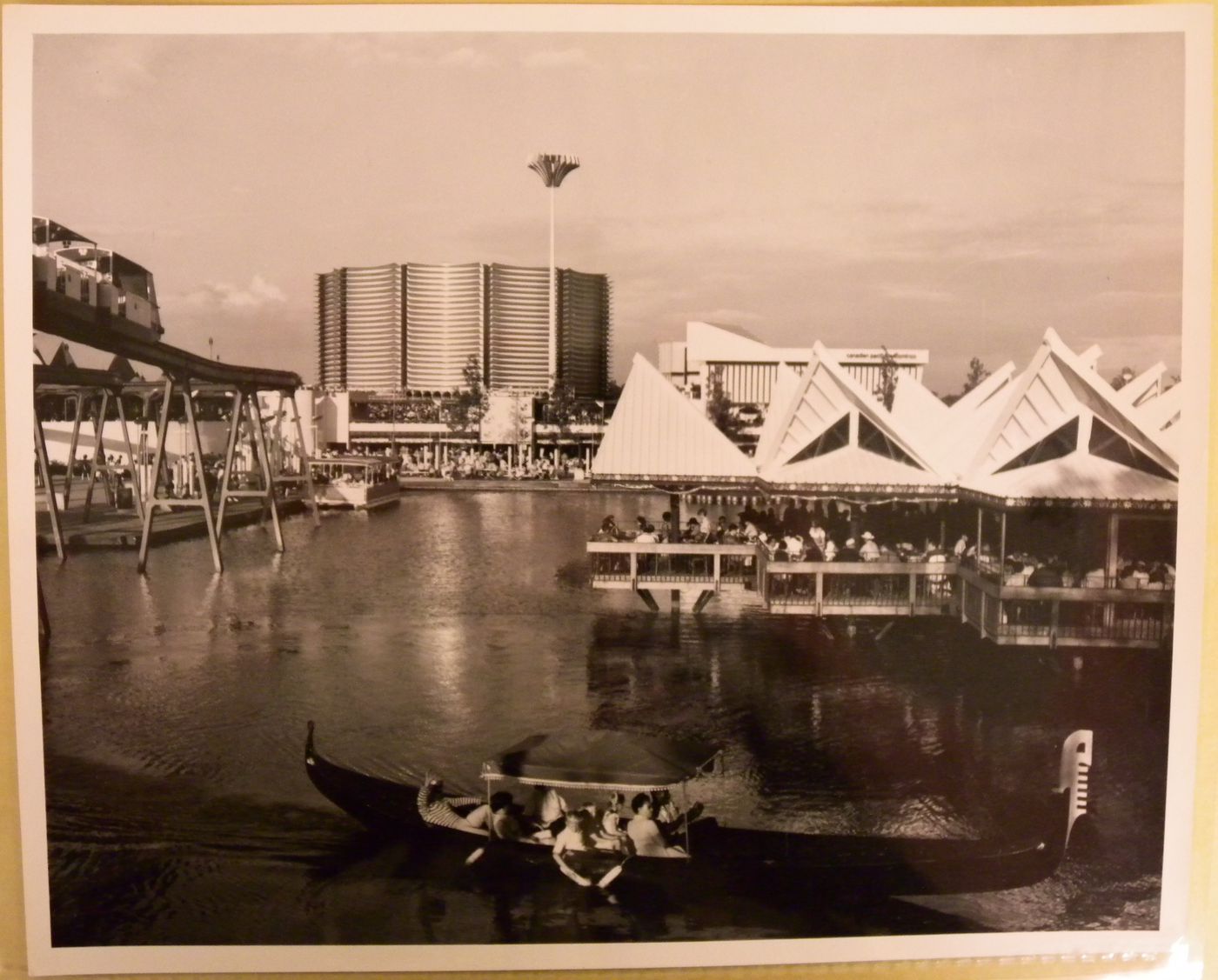 View on a waterway with a gondola in foreground and the Canadian Pacific-Cominco Pavilion in background, Expo 67, Montréal, Québec