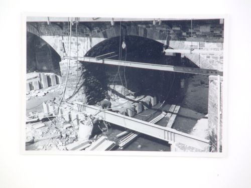 View of construction on stone arches of Barnstaple Long Bridge, Devon, United Kingdom