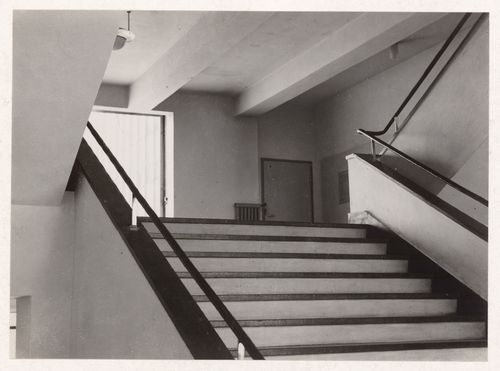 Interior view of the workshop wing of the Bauhaus building showing stairs, Dessau, Germany