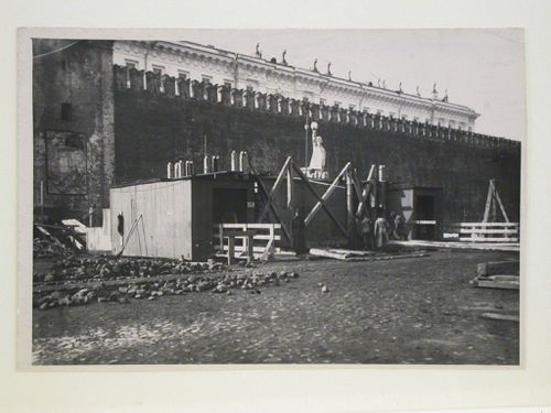 View of the construction site of the first wooden Lenin Mausoleum showing the access wing of the mausoleum and a monument, Red Square, Moscow