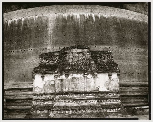 View of a façade of a dagoba with a brick wall in the background, Sri Lanka