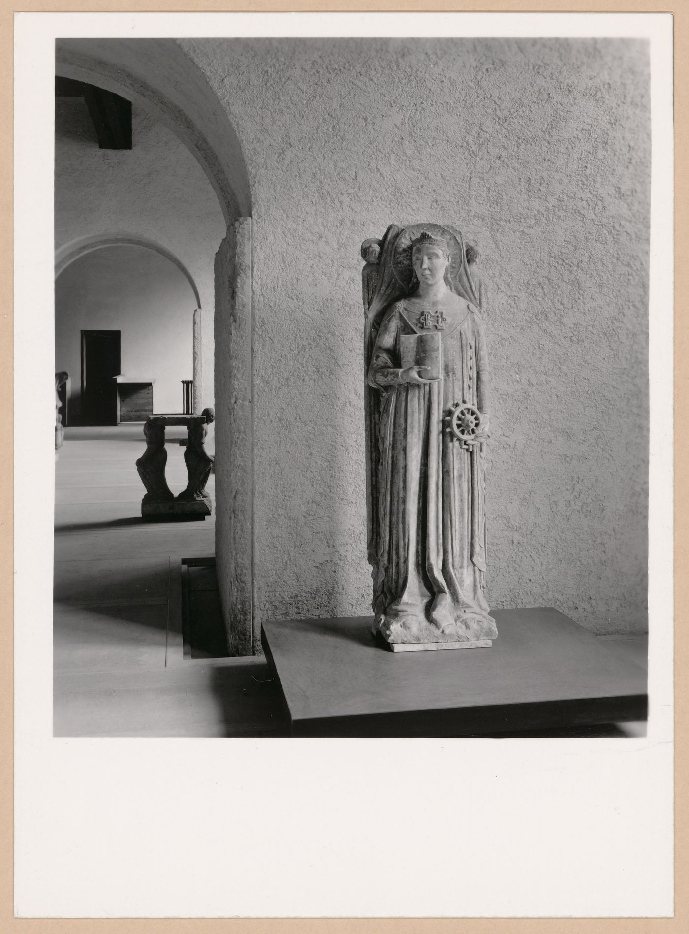 Interior view of a gallery showing a statue with doorways and other galleries on the left, Museo di Castelvecchio, Verona, Italy