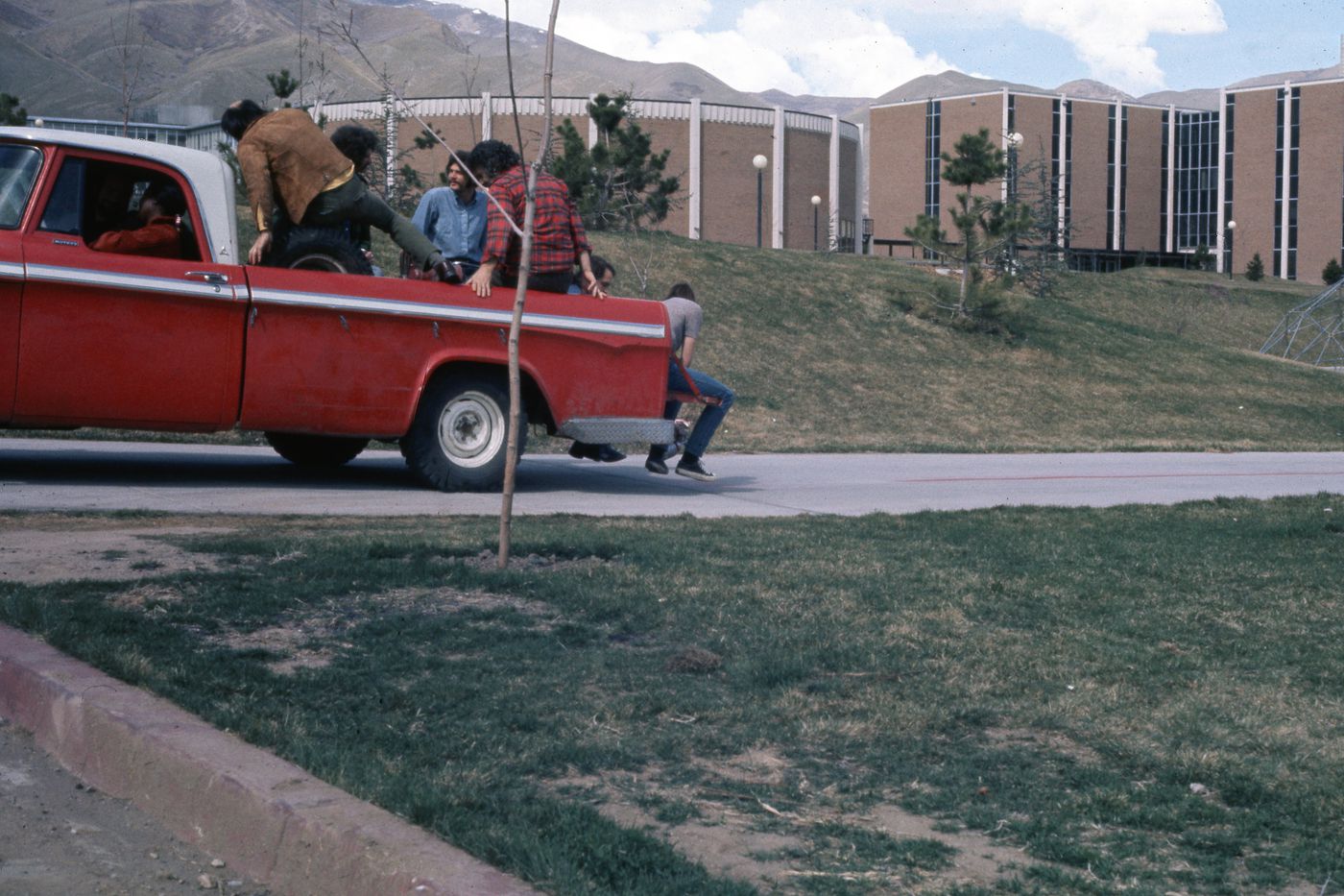 Slide of students in back of truck for Red Line