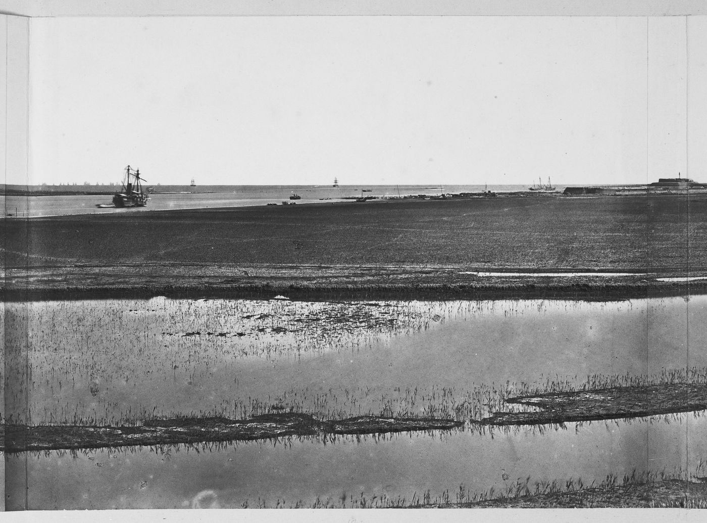 View showing the Pei (now Hai) River delta, with part of the Great South Taku Fort in the background, Taku (now Dagu), near Tientsin (now Tianjin), China