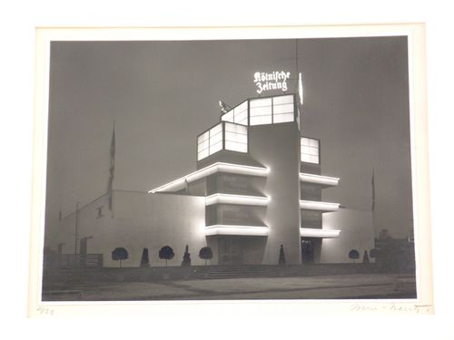 Exterior view at an angle of façade of Könische Zeitung press building by night, Cologne, Germany