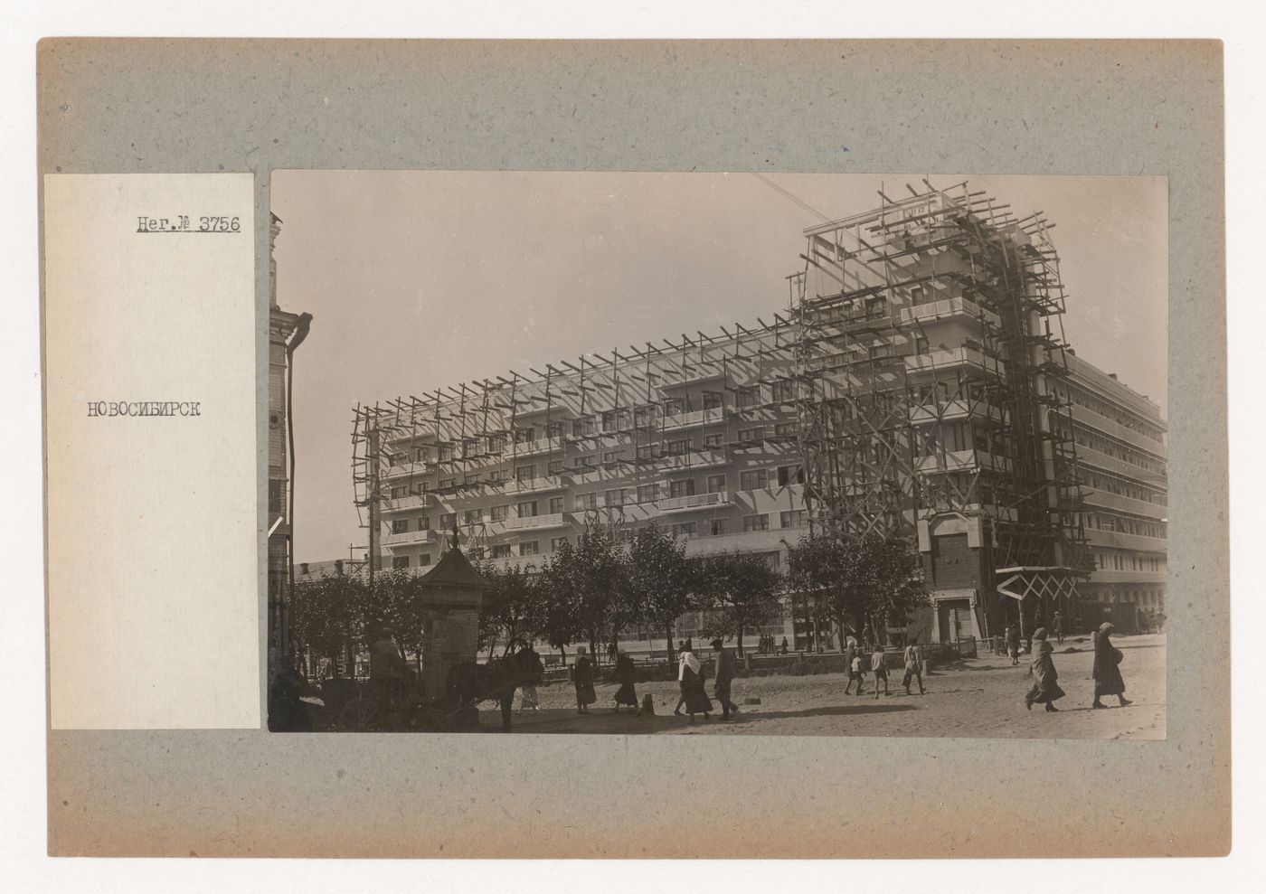 View of the principal façade of the "House with a Clock" under construction, Novosibirsk, Soviet Union (now in Russia)