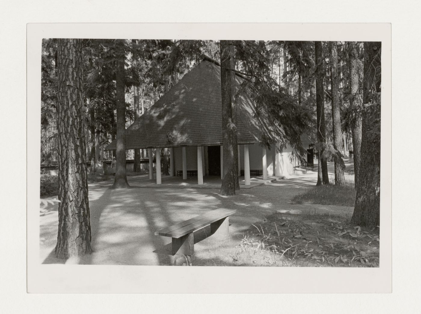 View of the principal façade of Woodland Chapel showing the portico, walkway and surrounding forest, Woodland Cemetery, Stockholm