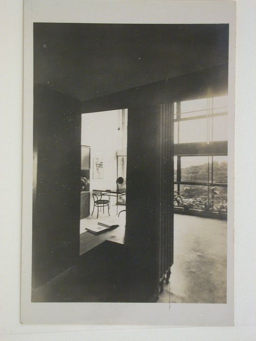 Interior view of the living room of House 13 showing a table and chairs, Weissenhofsiedlung, Stuttgart, Germany