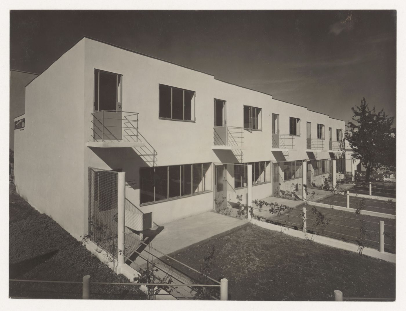 View of the rear façade of Houses 5, 6, 7, 8 and 9 showing the back yards, Weissenhofsiedlung, Stuttgart, Germany