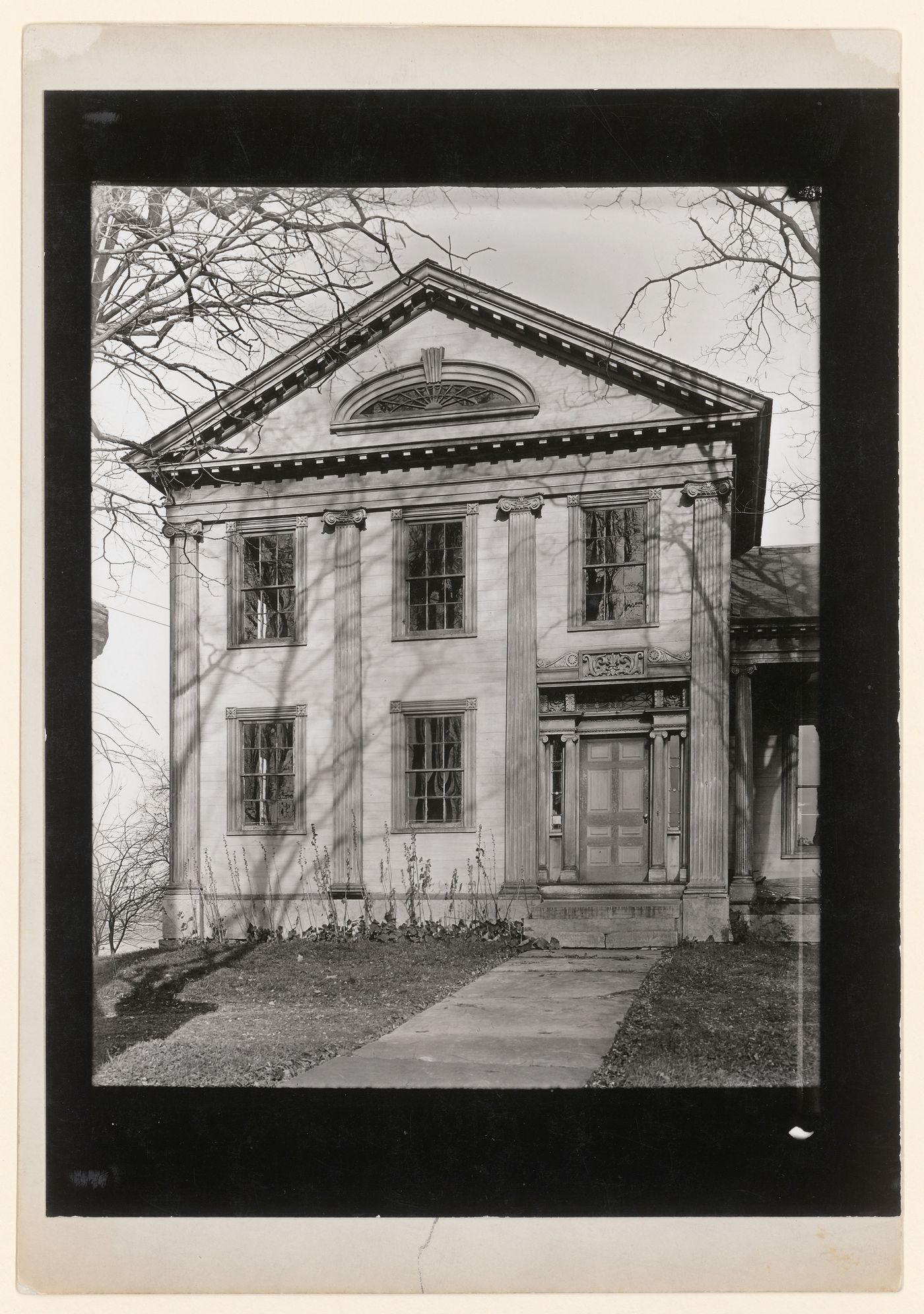 Front view of house with columns and front walk, New York