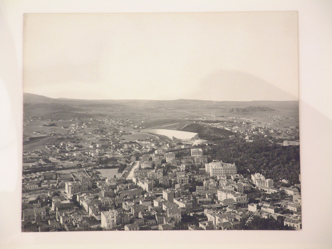 Aerial view of an unidentified city with a stadium