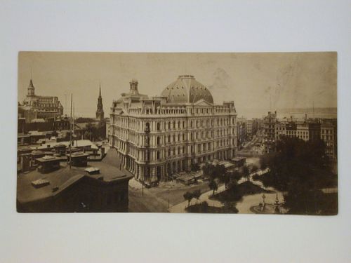 View from a roof top of street corner with large domed building in center, park on right, New York City, New York