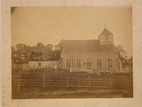 View of the north façade of the Church of All Saints showing its cemetery, Whiteparish, Wiltshire, England