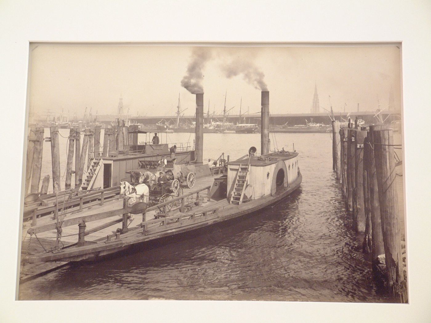 View of Elbe River wharves and ferry approaching quay, Hamburg, Germany