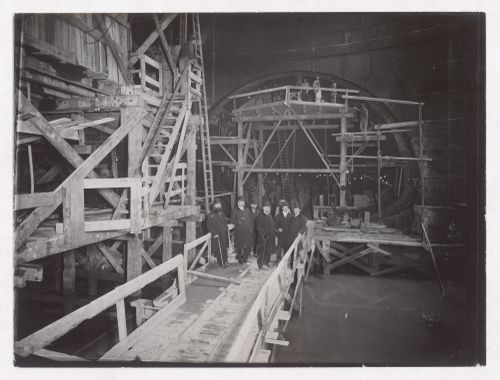 Construction of the Paris Metro, interior view with men standing on constructed walkways, Paris, France