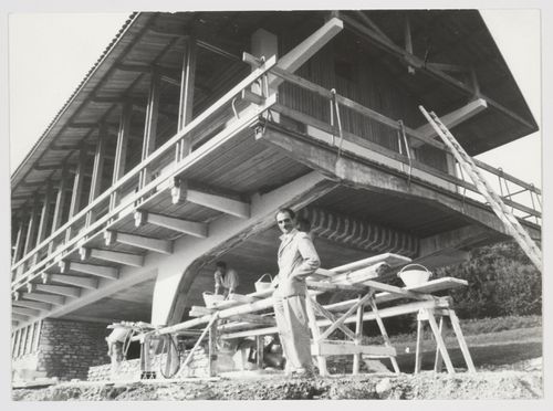 Exterior view showing the architect Carlo Mollino in front of the Casa sull'altopiano di Agra, Luino, Italy