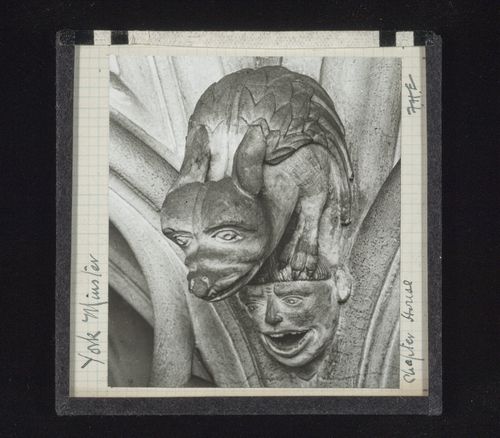 View of sculpture of grotesque figure on man's head in Chapter House, York Minster, York, North Yorkshire, England