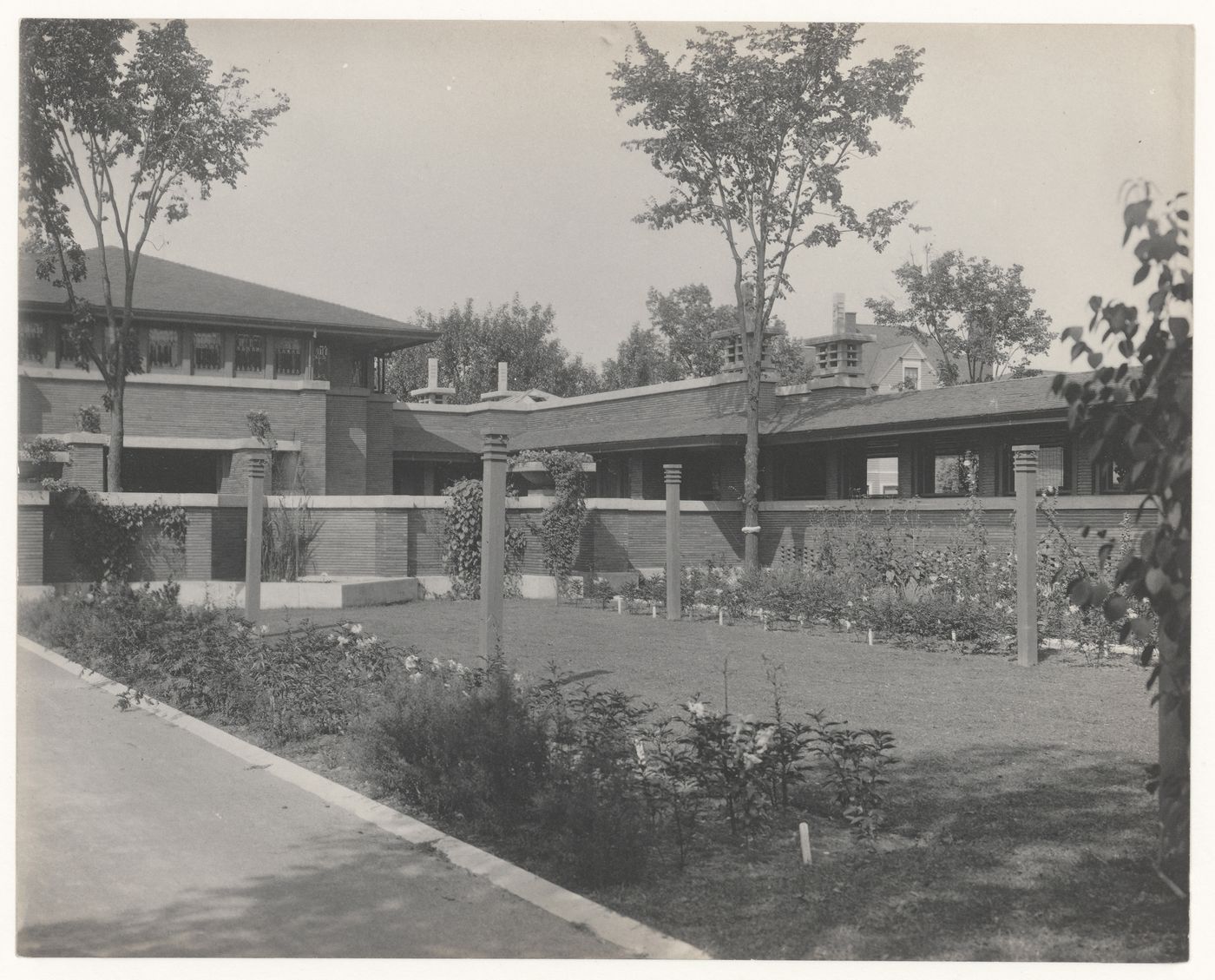 View of Darwin D. Martin House showing the house from the garden, and the garage, stable, pergola and clothes poles, Buffalo, New York