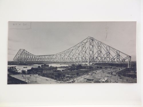 View of Kolkata tram and the Howrah Bridge over the Hooghly River, West Bengal, India