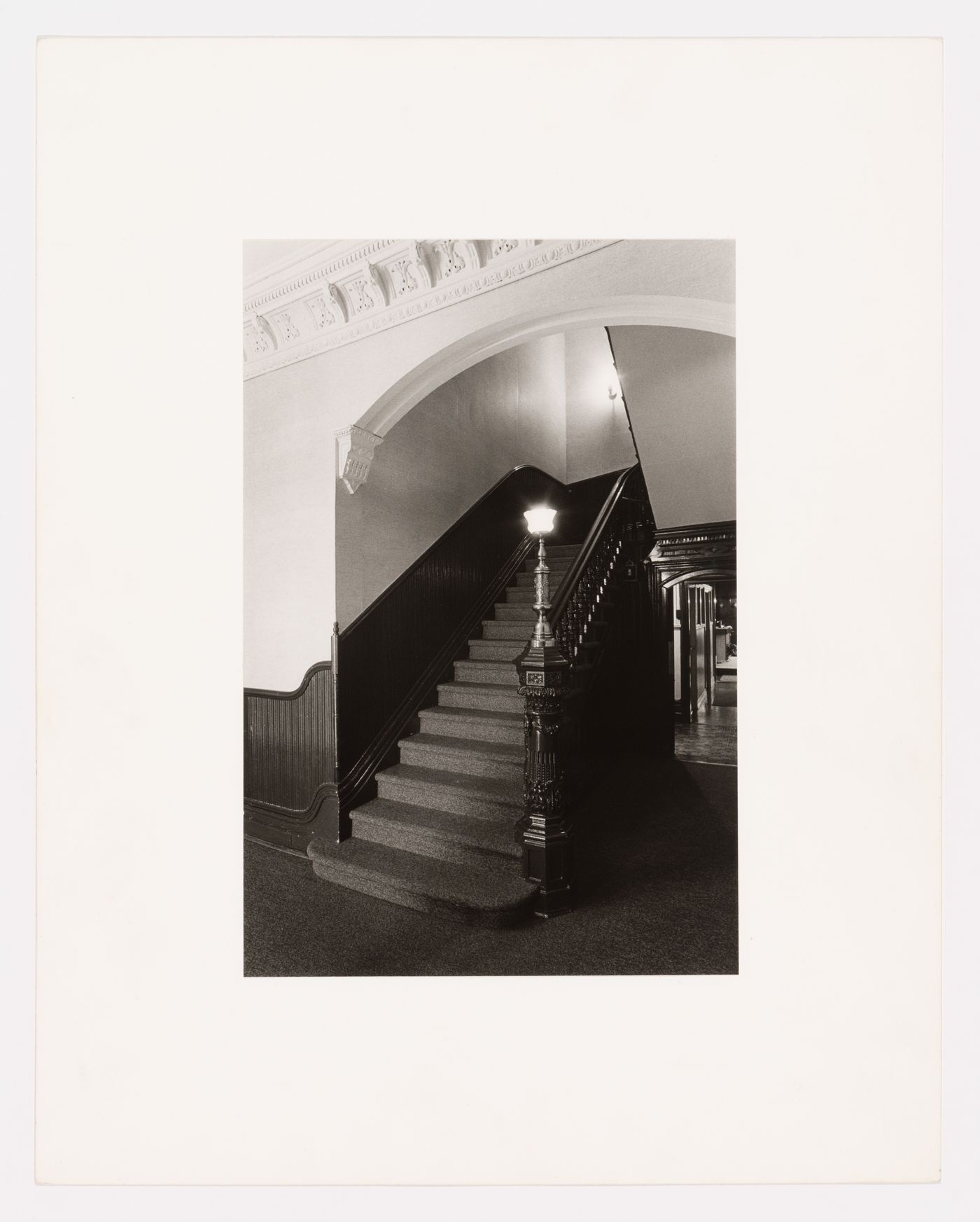 Interior view of the original carved wooden stairs in the east part of Shaughnessy House, Montréal, Québec, Canada