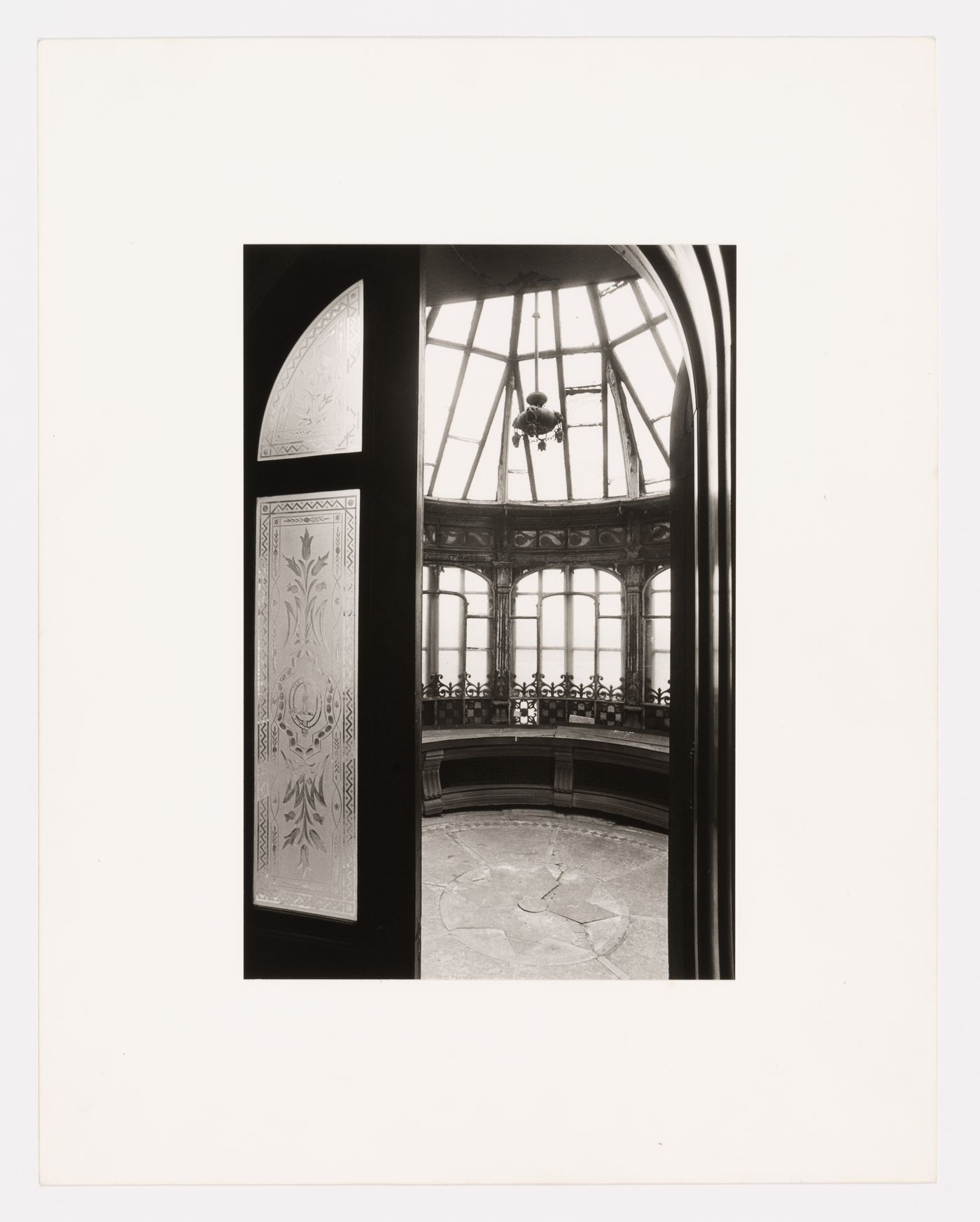 Interior view of the conservatory showing the frosted glass doors and the glazed and ironwork ceiling, Shaughnessy House, Montréal, Québec, Canada