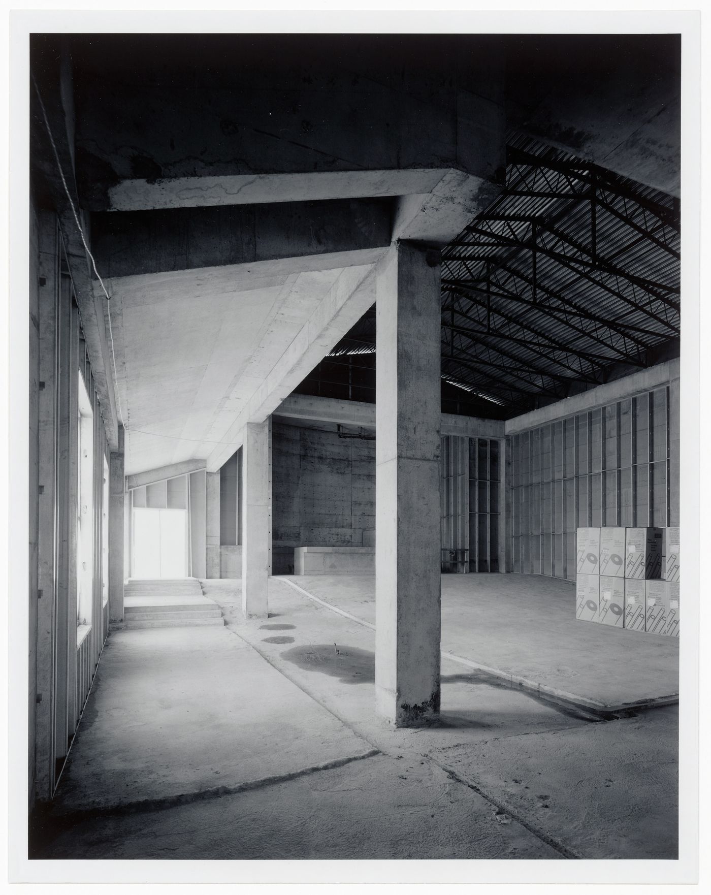 Interior view of the Paul Desmarais Theatre showing columns and metal roof trusses, Canadian Centre for Architecture under construction, Montréal, Québec