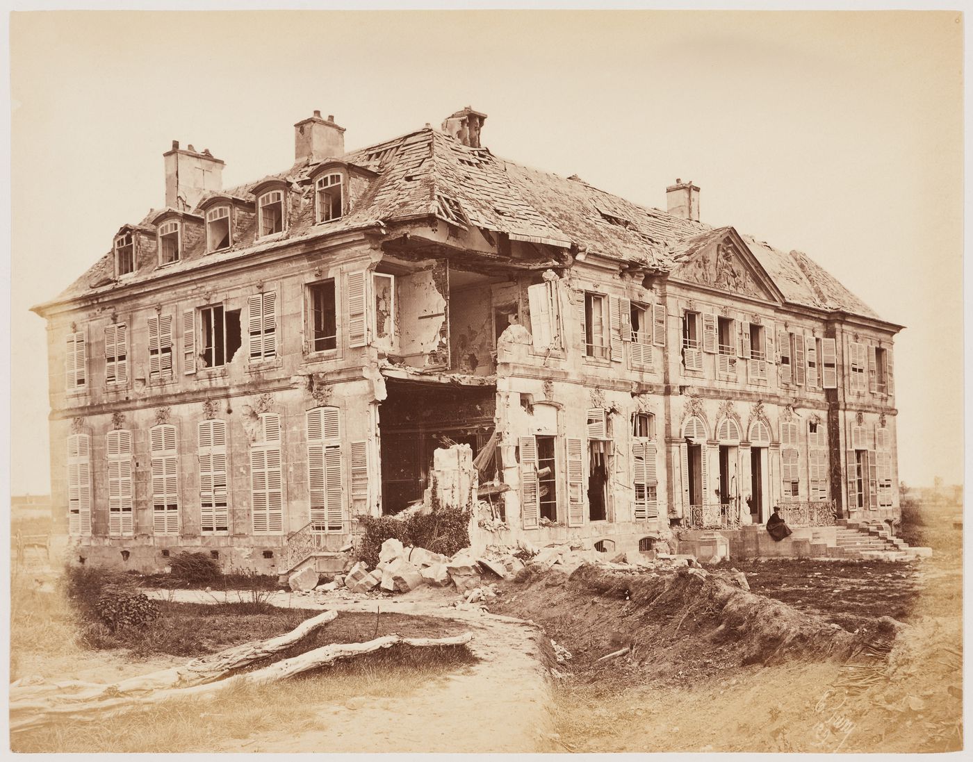 View of the Château de Meudon [?] showing a woman on the right after the Paris Commune uprising of 1871, Meudon [?], France