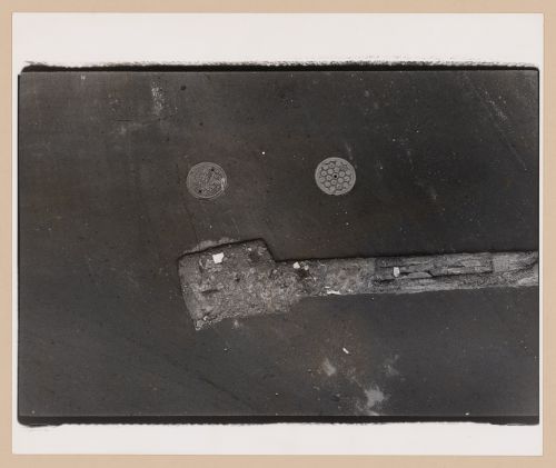 Aerial view of an asphalt street showing two manhole covers, New York City