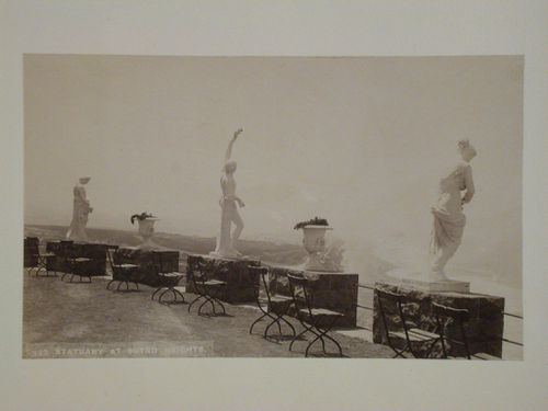 View of the parapet of Sutro Heights showing chairs, statues and urns, San Francisco, California